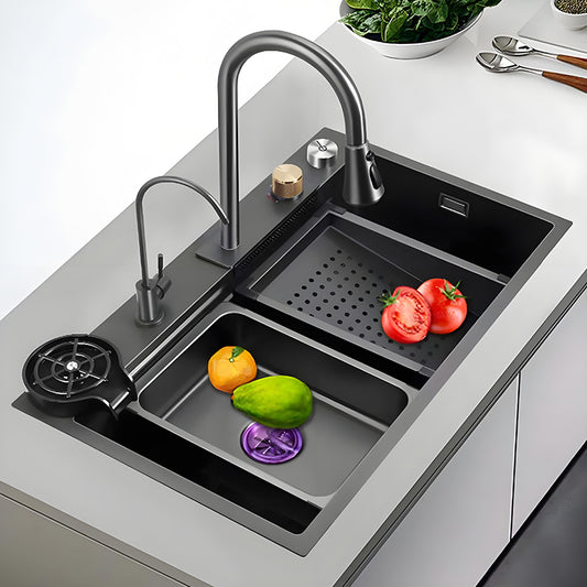 Black and gray multifunctional stainless steel workstation kitchen sink with high-arc faucet, auxiliary faucet, cup washer, inner basin, perforated drain tray, and vegetable washing area.