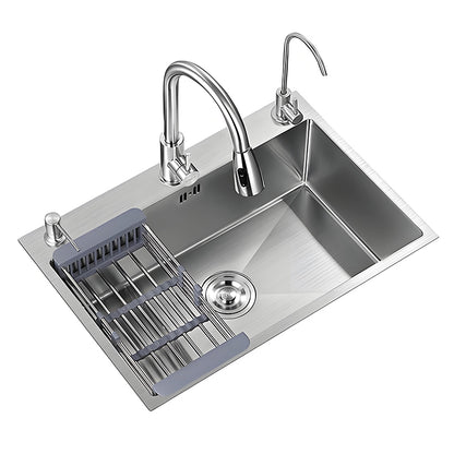 Brushed stainless steel single bowl kitchen sink with roll-up drain rack, main faucet, auxiliary faucet, soap dispenser, round drain system, and spacious rectangular washing bowl.
