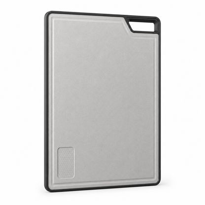 Double-sided sliding cutting board for multifunction kitchen sink, showing the light grey wheat fiber surface, black protective frame, raised edge, and integrated handle opening.