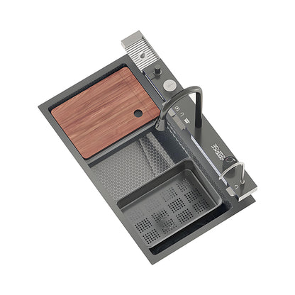 Gray multifunctional workstation kitchen sink with wooden cutting board, perforated drain basket, inner basin, waterfall outlet, high-arc faucet, auxiliary faucet, and rear control rail.