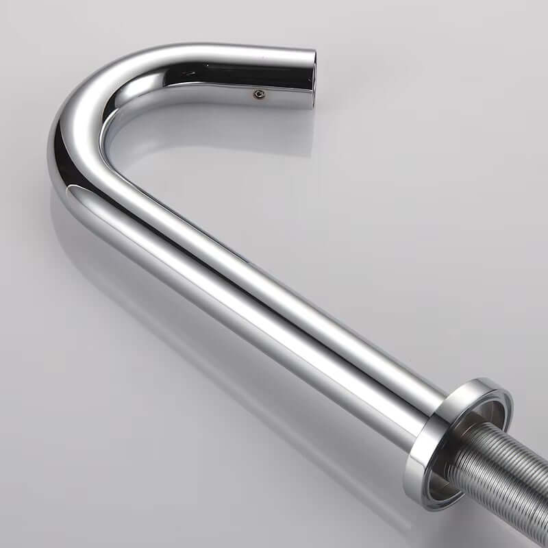Close-up of a polished chrome sink faucet pipe, showcasing its sleek modern design and high-quality finish.