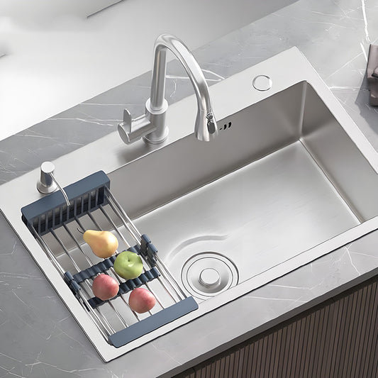 Natural stainless steel single bowl kitchen sink installed in a gray countertop with high-arc faucet, roll-up drain rack, fruit, round drain cover, and spacious brushed sink bowl.